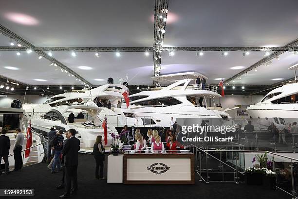 Visitors admire the boats on display on the Sunseeker stand at the 2013 London Boat Show, held at the ExCeL Centre, on January 14, 2013 in London,...