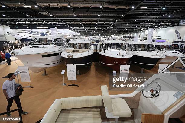 Visitors admire the boats on display at the 2013 London Boat Show, held at the ExCeL Centre, on January 14, 2013 in London, England. Until January...
