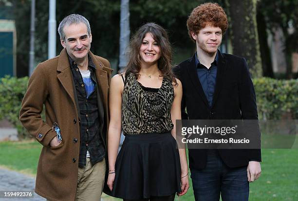 Director Olivier Assayas, actress Carole Combes and actor Hugo Conzelmann attend the 'Apres Mai' photocall at Casa del Cinema on January 14, 2013 in...