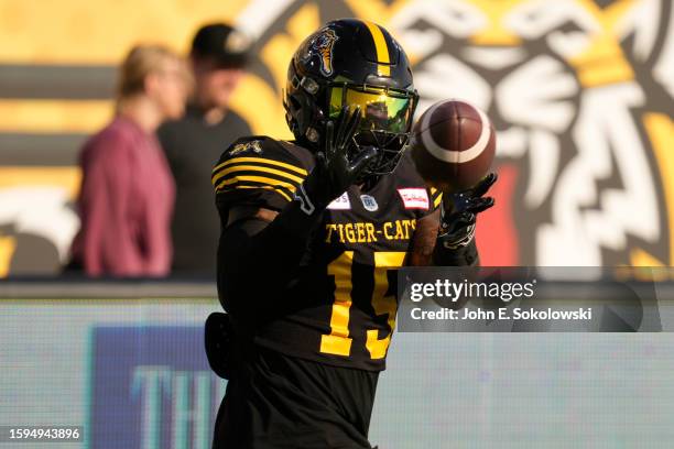 Kyle Wilson of the Hamilton Tiger-Cats makes a catch during warm up before a game against the Montreal Alouettes at Tim Hortons Field on August 5,...