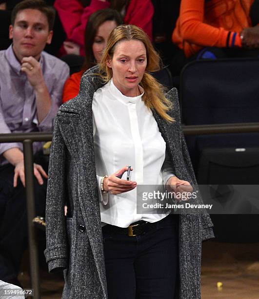 Uma Thurman attends the New Orleans Hornets vs New York Knicks game at Madison Square Garden on January 13, 2013 in New York City.