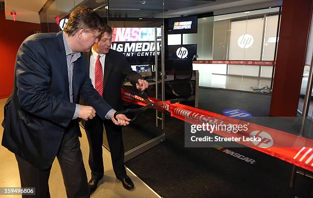 Brian France, NASCAR Chairman and CEO, and Stephen DeWitt, Hewlett Packard Senior Vice President Enterprise, cut the ceremonial ribbon to officially...
