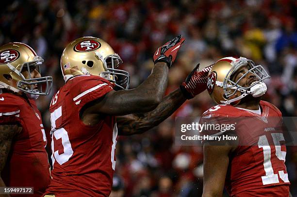 Tight end Vernon Davis celebrates with Wide receiver Michael Crabtree of the San Francisco 49ers after scoring a touchdown in the second quarter...