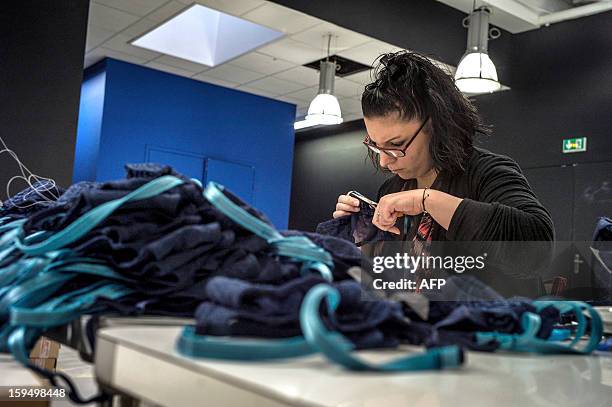 An employee of the new lingerie company "Les Atelieres" works in Villeurbanne, centraleastern France, on January 14, 2013. "Les Atelieres" was...