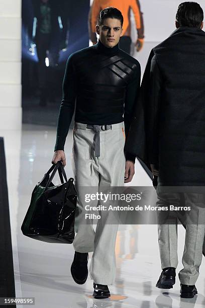 Model walks the runway during Dirk Bikkembergs show as a part of Milan Fashion Week Menswear Autumn/Winter 2013 on January 14, 2013 in Milan, Italy.