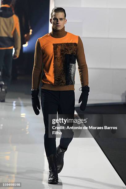 Model walks the runway during Dirk Bikkembergs show as a part of Milan Fashion Week Menswear Autumn/Winter 2013 on January 14, 2013 in Milan, Italy.