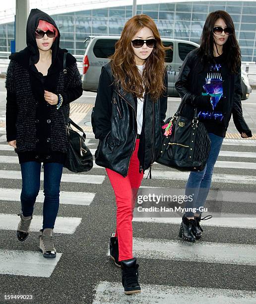 Jeon Ji-Yoon , Heo Ga-Yoon and Jihyun of South Korean girl group 4minute is seen at Incheon International Airport on January 14, 2013 in Incheon,...