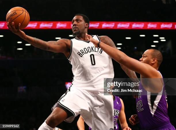 Andray Blatche of the Brooklyn Nets in action against Chuck Hayes of the Sacramento Kings at Barclays Center on January 5, 2013 in the Brooklyn...