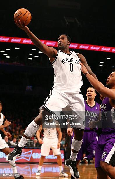 Andray Blatche of the Brooklyn Nets in action against Chuck Hayes of the Sacramento Kings at Barclays Center on January 5, 2013 in the Brooklyn...