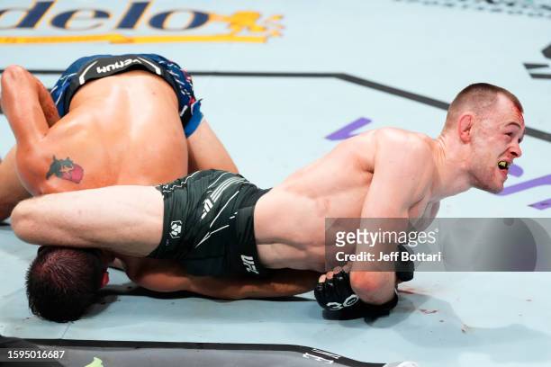 Jake Hadley of England works for a submission against Cody Durden in a flyweight fight during the UFC Fight Night event at Bridgestone Arena on...