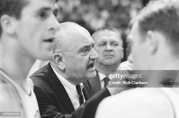 Final Four: Closeup of Kentucky coach Adolph Rupp on sidelines with players during game vs Texas Western at Cole Field House. College Park, MD...