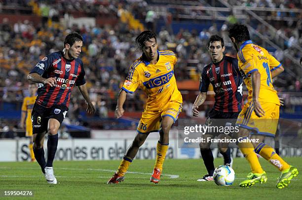 Jose Antonio Castro, Lucas Lobos and Cristian Maidana fights for the ball during a match between Atlante and Tigres as part of the Torneo Clausura...