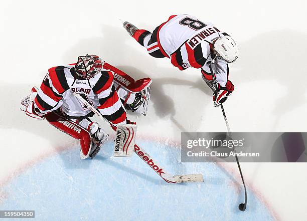 Ryan Van Stralen of the Ottawa 67's gets a puck past teammate Jacob Blair in the warm-up prior to an OHL game against the London Knights on January...