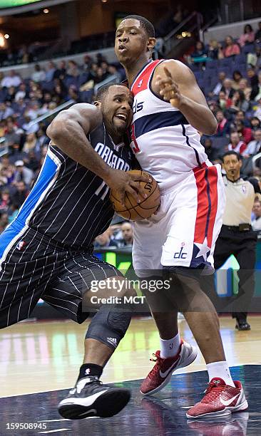 Orlando Magic power forward Glen Davis drives to the basket against Washington Wizards power forward Kevin Seraphin during the first half of their...