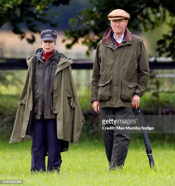 Princess Anne, Princess Royal and Vice Admiral Sir Timothy Laurence watch Zara Tindall compete, on her horse 'Class Affair', in the dressage phase of...