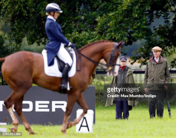 Princess Anne, Princess Royal and Vice Admiral Sir Timothy Laurence watch Zara Tindall compete, on her horse 'Class Affair', in the dressage phase of...
