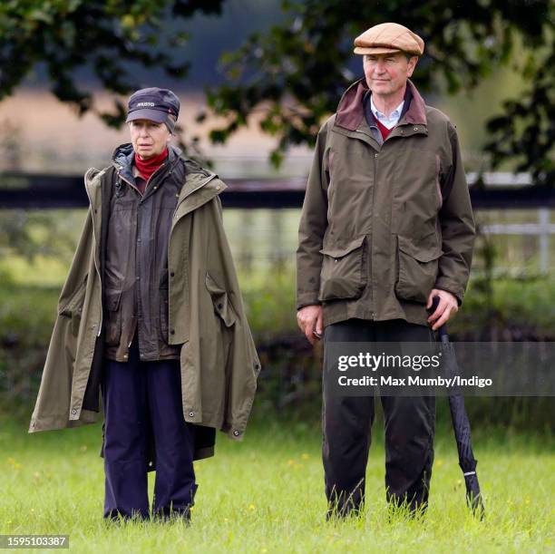 Princess Anne, Princess Royal and Vice Admiral Sir Timothy Laurence watch Zara Tindall compete, on her horse 'Class Affair', in the dressage phase of...