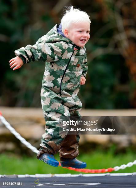 Lucas Tindall plays on a trampoline as he attends day 2 of the 2023 Festival of British Eventing at Gatcombe Park on August 5, 2023 in Stroud,...