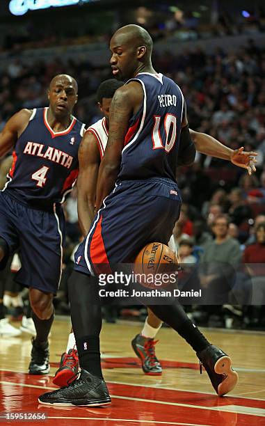Johan Petro of the Atlanta Hawks ends up with the ball bouncing off of his rear end after Nazr Mohammed of the Chicago Bulls looses it at the United...