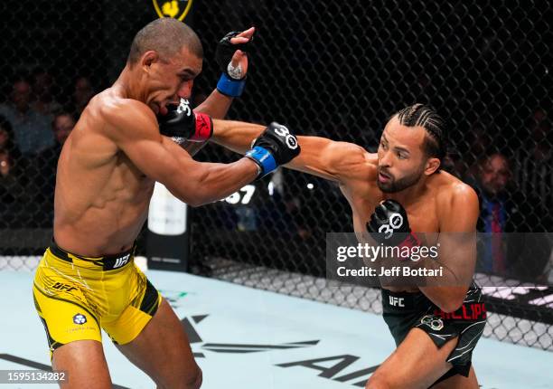 Kyler Phillips punches Raoni Barcelos of Brazil in a bantamweight fight during the UFC Fight Night event at Bridgestone Arena on August 05, 2023 in...