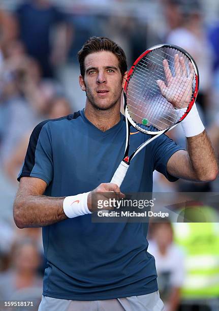 Juan Martin Del Potro of Argentina celebrates winning his first round match against Adrian Mannarino of France during day two of the 2013 Australian...
