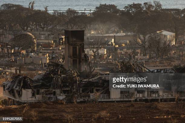 Burned houses and buildings are pictured in the aftermath of a wildfire, is seen in Lahaina, western Maui, Hawaii on August 12, 2023. Hawaii's...