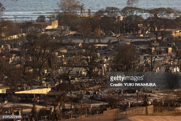 Burned houses and buildings are pictured in the aftermath of a wildfire, is seen in Lahaina, western Maui, Hawaii on August 12, 2023. Hawaii's...