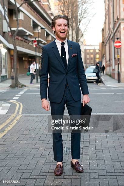 Dan Kennedy fashion journalist for Idol Magazine wearing shoes form a charity shop, Reiss tie and suit and TM Lewin shirt on day 3 of London Mens...