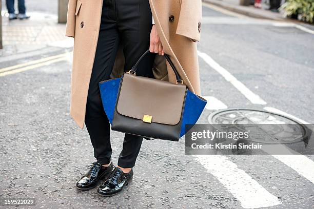 Louis Redpath account manager at Rainbow Wave wearing Stella McCartney trousers, Celine bag and clerks shoes on day 3 of London Mens Fashion Week...