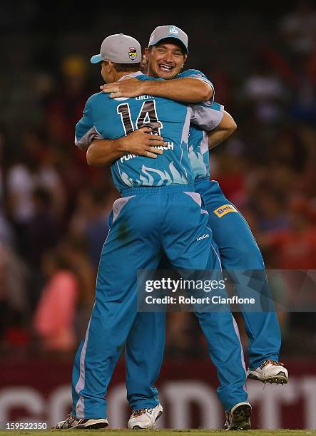 Luke Pomersbach and Peter Forrest of the Heat celebrate after the Heat defeated the Renegades during the Big Bash League Semi-Final match between the...