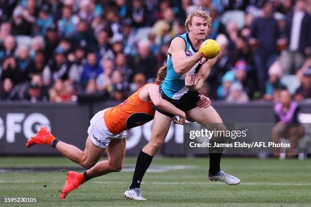 Lachie Whitfield of the Giants tackles Jason Horne-Francis of the Power during the 2023 AFL Round 22 match between the Port Adelaide Power and the...