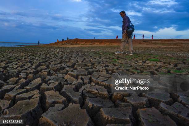 People visit the dried-up Udawalawa reservoir in Udawalawa, Sri Lanka, on August 12, 2023. Udawalawe Reservoir is a reservoir situated on the border...