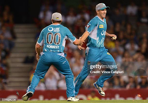 Nathan Hauritz of the Heat celebrates with Peter Forrest after dismissing Peter Nevill during the Big Bash League Semi-Final match between the...