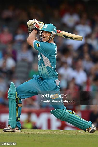 Luke Pomersbach of the Heat smashes another boundary during his not out innings of 112 during the Big Bash League Semi-Final match between the...