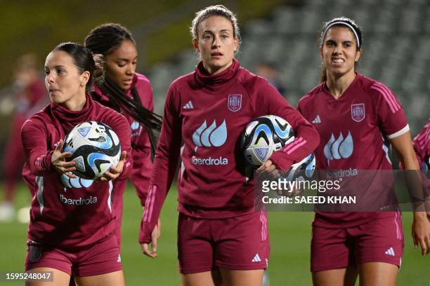 Spain's players Claudia Zornoza Alexia Putella, and Alba Redonda take part in a training session at the North Harbour Stadium in Auckland on August...