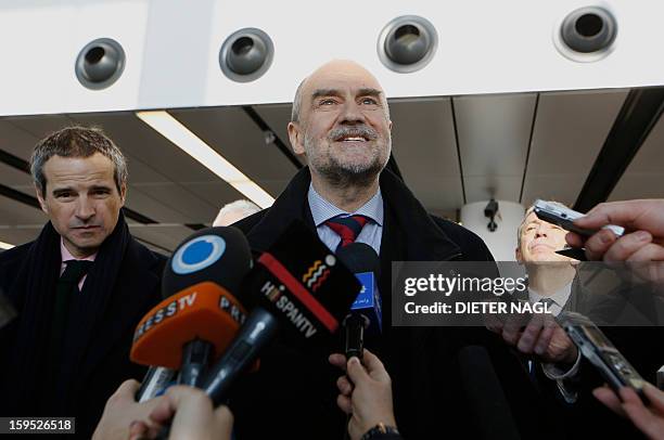 Deputy Director General and Head of the Department of Safeguards Herman Nackaerts talks with journalists as he leaves for another trip with his team...