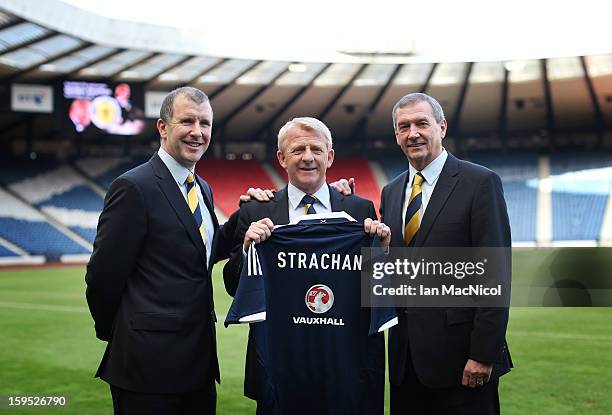 Gordon Strachan poses holding a Scotland shirt with Scottish FA Chief Executive Stewart Regan and Scottish FA President Campbell Ogilvie after being...