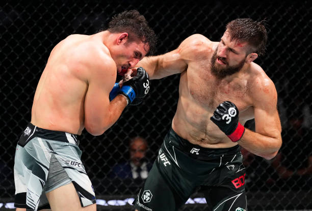 Tanner Boser of Canada punches Aleksa Camur of Bosnia and Herzegovina in a light heavyweight fight during the UFC Fight Night event at Bridgestone...