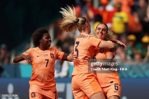 Jill Roord of Netherlands celebrates with teammates Lineth Beerensteyn and Stefanie Van Der Gragt after scoring her team's first goal during the FIFA...