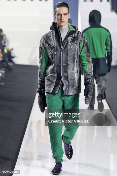 Model walks the runway during the Dirk Bikkembergs Ready to Wear Fall/Winter 2013-2014 how as part of Milan Fashion Week Menswear Autumn/Winter 2013...