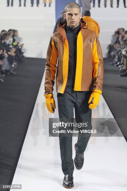 Model walks the runway during the Dirk Bikkembergs Ready to Wear Fall/Winter 2013-2014 how as part of Milan Fashion Week Menswear Autumn/Winter 2013...