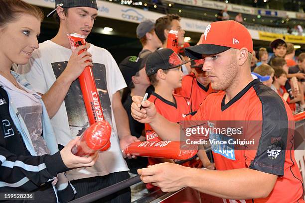 Aaron Finch of the Renegades signing autographs after the Big Bash League Semi-Final match between the Melbourne Renegades and the Brisbane Heat at...