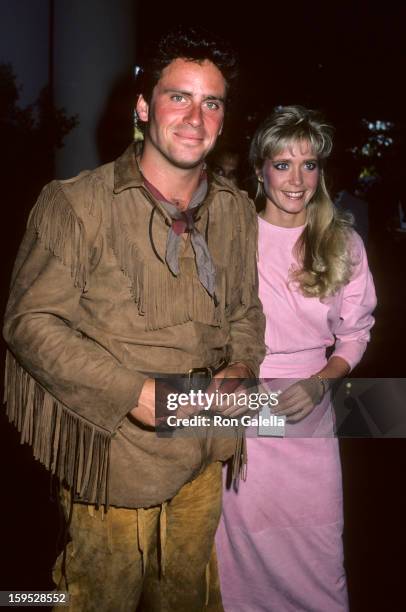 Actor Ethan Wayne and wife attend Fourth Annual Golden Boot Awards on August 15, 1986 at the Westwood Marquis Hotel in Westwood, California.