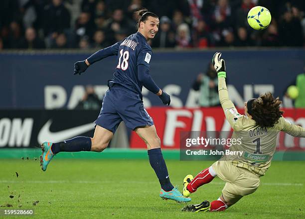 Zlatan Ibrahimovic of PSG shoots towards goal as Guillermo Ochoa, goalkeeper of AC Ajaccio tries to make a save during the French Ligue 1 match...