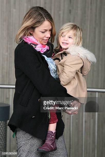 Christine Baumgartner and her daughter Grace Avery are seen at Roissy airport on January 15, 2013 in Paris, France.