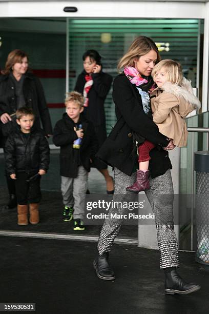 Christine Baumgartner, her sons Hayes and Cayden and her daughter Grace Avery are seen at Roissy airport on January 15, 2013 in Paris, France.