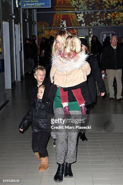 Christine Baumgartner, her sons Hayes and Cayden and her daughter Grace Avery are seen at Roissy airport on January 15, 2013 in Paris, France.