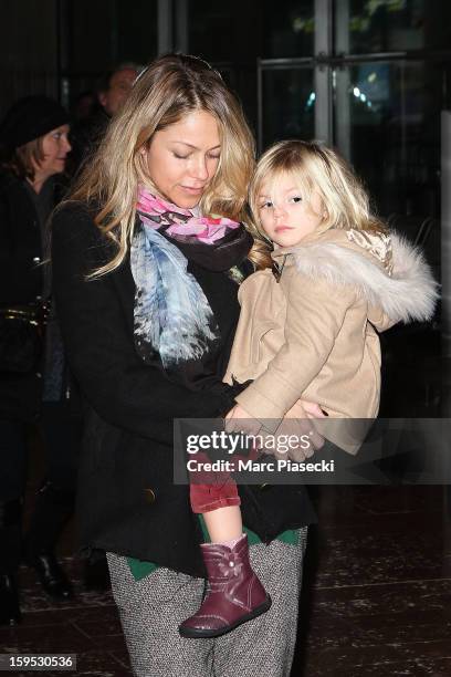 Christine Baumgartner and her daughter Grace Avery are seen at Roissy airport on January 15, 2013 in Paris, France.