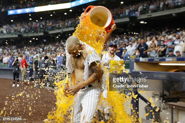 Blake Perkins of the Milwaukee Brewers is dunked with Gatorade after hitting a walk-off single in the tenth inning against the Pittsburgh Pirates at...