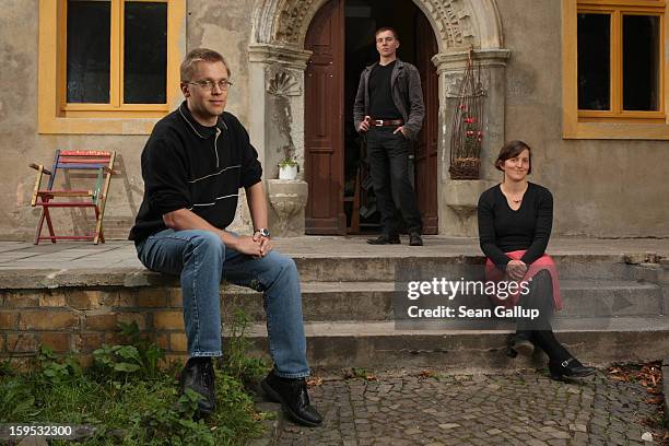 Frank Piotrowski, Benny Srock and Melanie Haller, who all work at the pro-democracy organization NDK , pose outside the NDK house on September 21,...